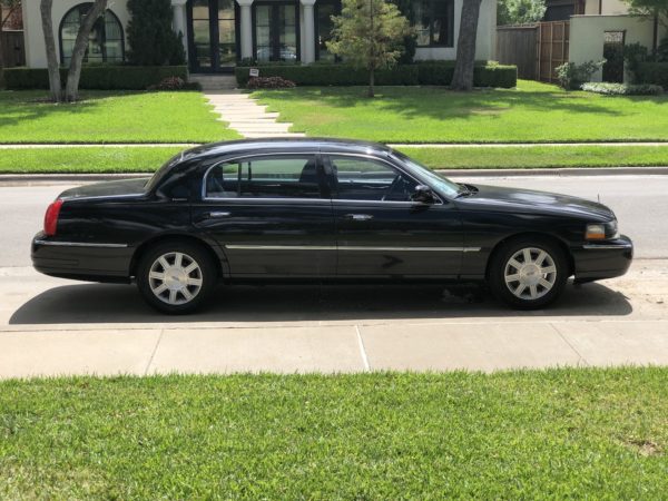 Transportation To Dallas-Fort Worth National Cemetery. Black Lincoln Town Car seats 3 passengers.