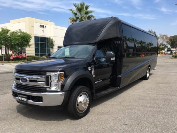 23 passenger limo bus outside picture.