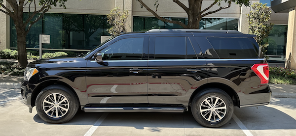 Black SUV seats 7 passengers. The Signature Collection at Preston Hollow Village To DFW International Airport.